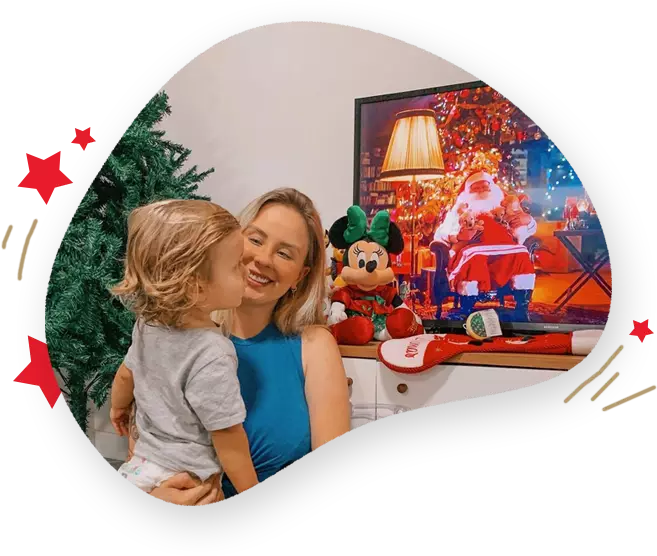 Família assistindo vídeo do Papai Noel